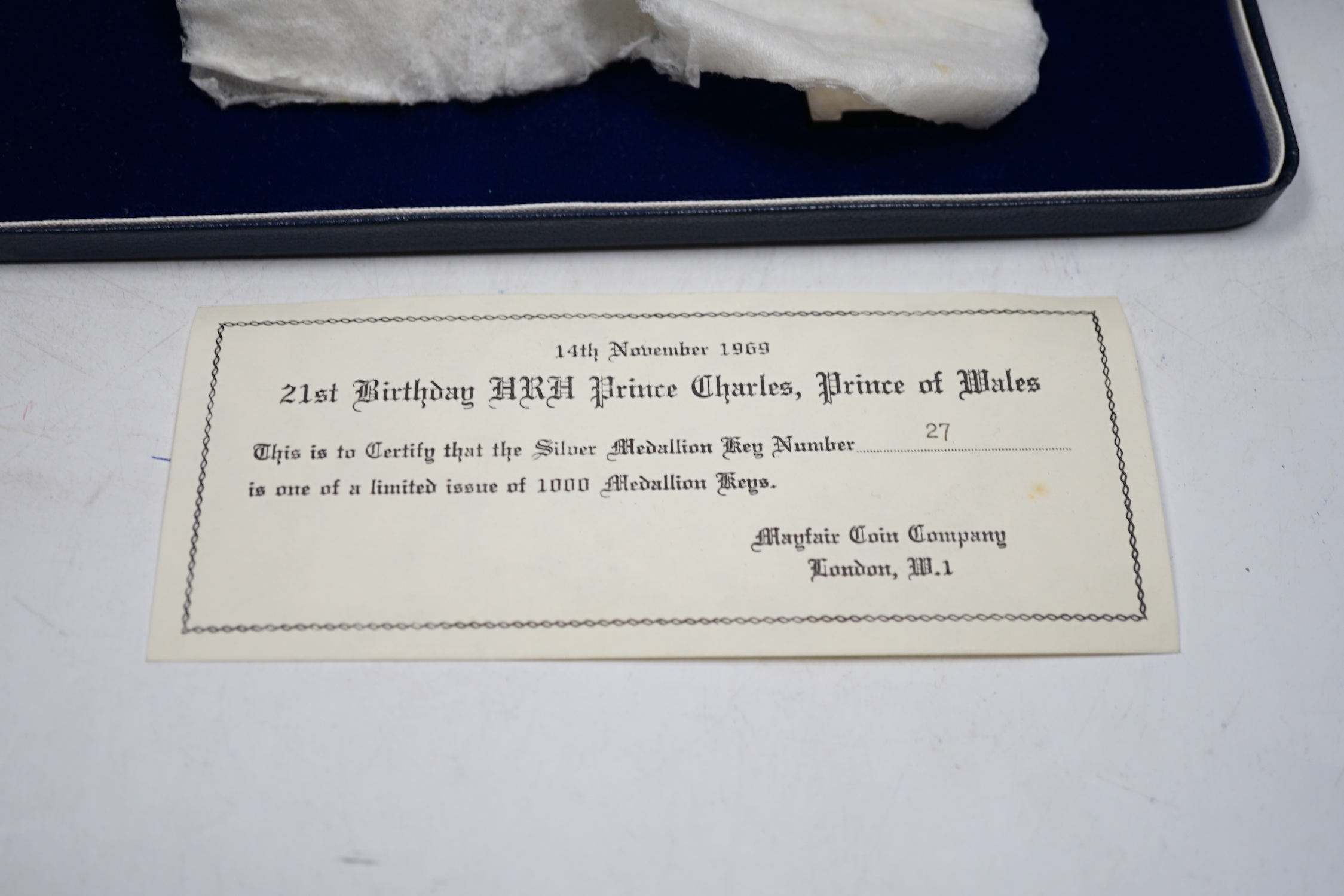 A cased Elizabeth II limited edition 'Prince of Wales Coming of Age' silver presentation key, Turner & Simpson, Birmingham, 1969, no. 27/1000, 12.7cm, 114 grams.